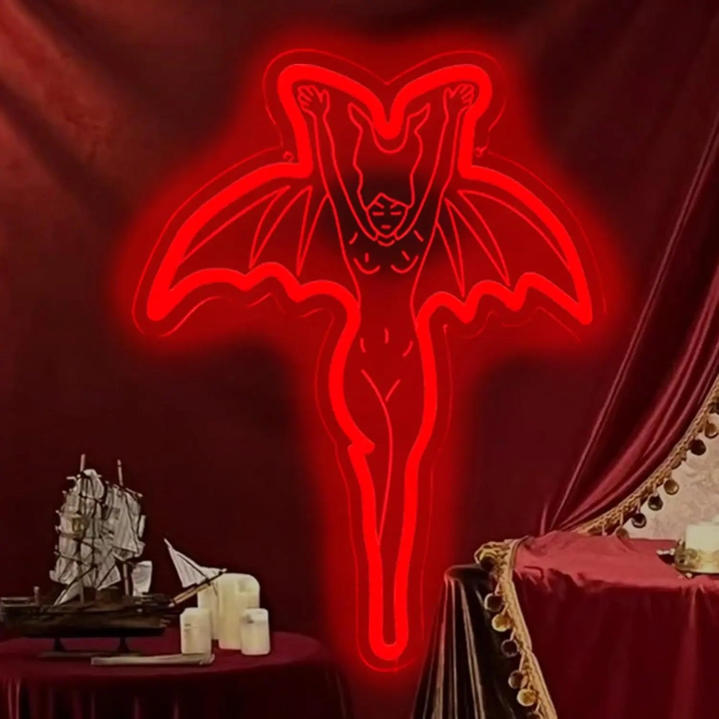 Red neon sign of a demon-like figure on a dark red background with decorative elements.