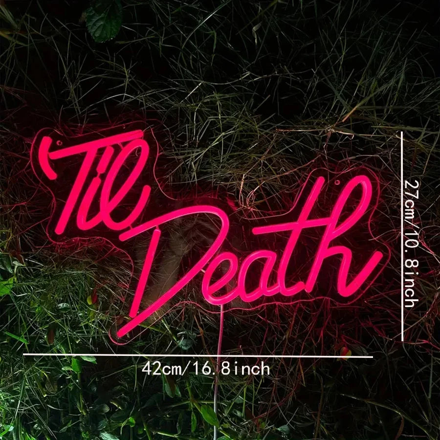 Neon sign with 'Til Death' text on a grassy background
