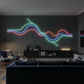 Neon light installation on a dark wall in a modern living room.